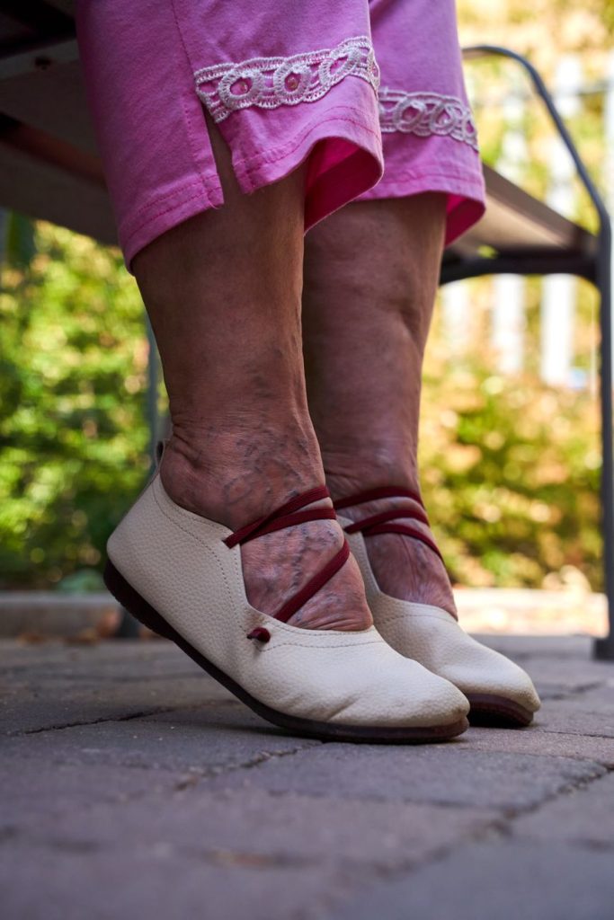senior woman relaxing outdoors in summer